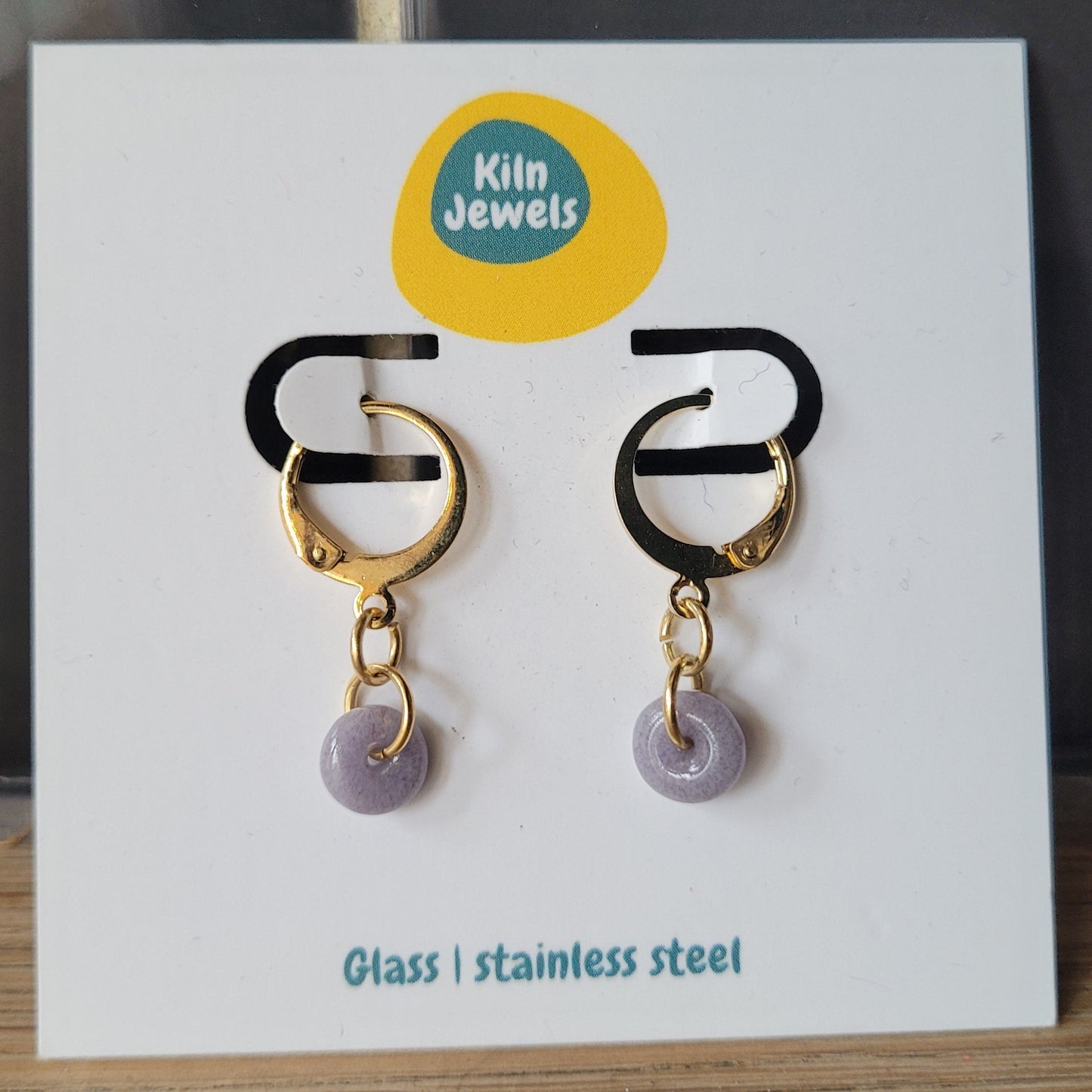 Small light purple glass donut dangle earrings